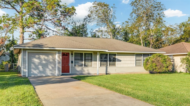 ranch-style house featuring a front yard and a garage