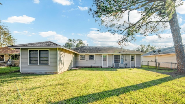 131 Laurel St, Lake Jackson, TX 77566 - back of house with a fenced backyard, a yard, and a gate