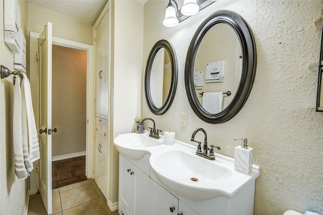 bathroom featuring tile patterned floors and vanity