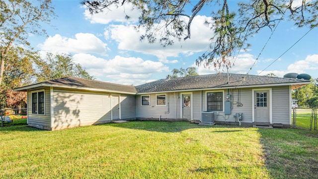 131 Laurel St, Lake Jackson, TX 77566 - back of property with a lawn, fence, and central AC unit