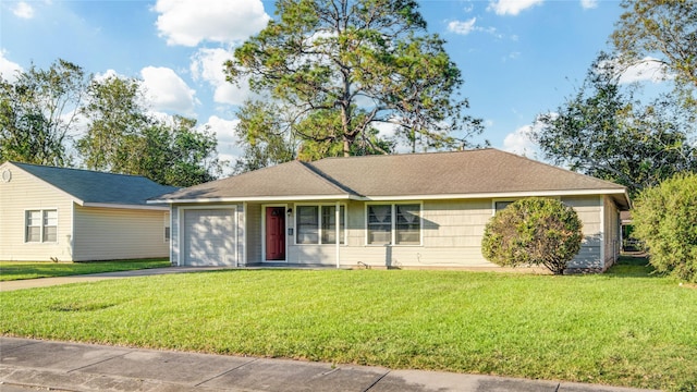131 Laurel St, Lake Jackson, TX 77566 - single story home with an attached garage, a front lawn, and aphalt driveway