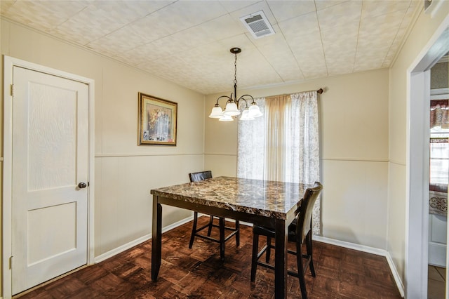 131 Laurel St, Lake Jackson, TX 77566 - dining area with a chandelier, visible vents, a wealth of natural light, and a wainscoted wall