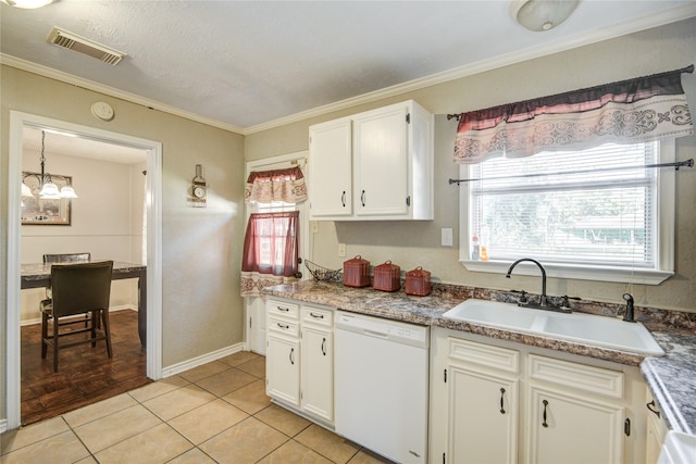 131 Laurel St, Lake Jackson, TX 77566 - kitchen with visible vents, a healthy amount of sunlight, white dishwasher, white cabinets, and a sink