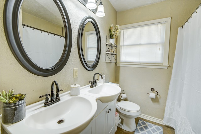 131 Laurel St, Lake Jackson, TX 77566 - bathroom with a sink, baseboards, and a textured wall