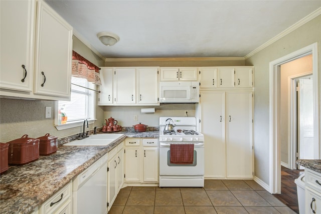 131 Laurel St, Lake Jackson, TX 77566 - kitchen with white appliances, dark tile patterned flooring, crown molding, and a sink