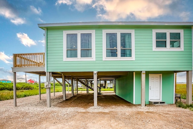 view of front of home with a carport