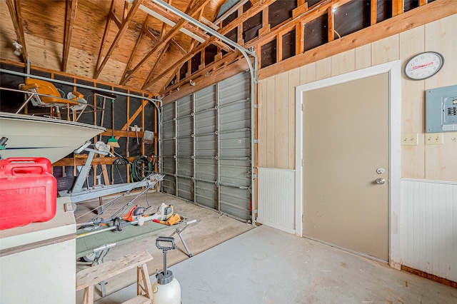 garage featuring wood walls