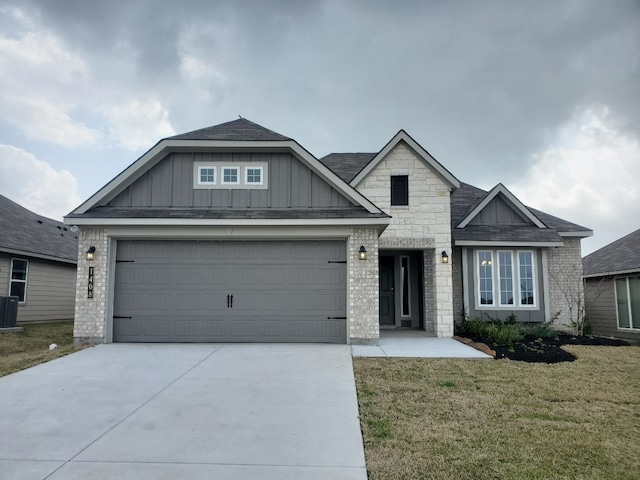 view of front of property with brick siding, board and batten siding, and driveway