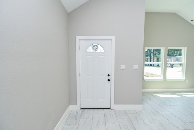 foyer with lofted ceiling