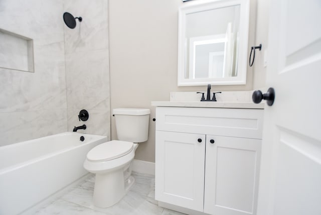 full bathroom with tiled shower / bath, vanity, and toilet