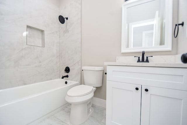 full bathroom with tiled shower / bath, vanity, and toilet