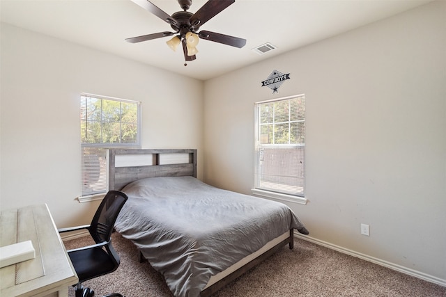 bedroom with ceiling fan and carpet