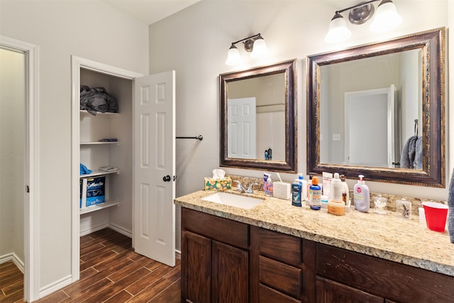 bathroom featuring wood-type flooring and vanity