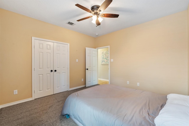 bedroom featuring ceiling fan, a closet, and carpet floors