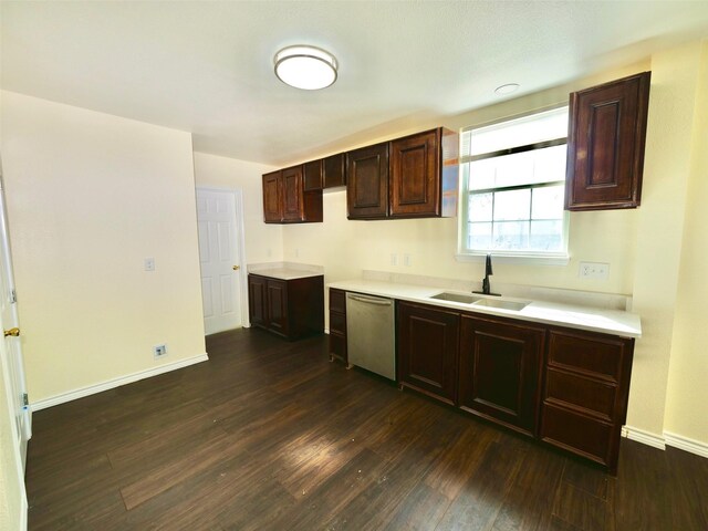 kitchen featuring a sink, dishwasher, dark wood-type flooring, light countertops, and dark brown cabinets