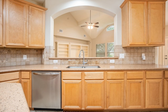 kitchen featuring dishwasher, sink, vaulted ceiling, decorative backsplash, and ceiling fan