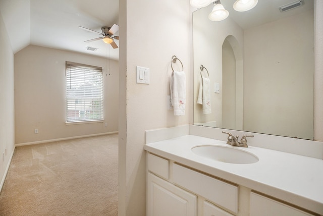 bathroom with vanity, vaulted ceiling, and ceiling fan