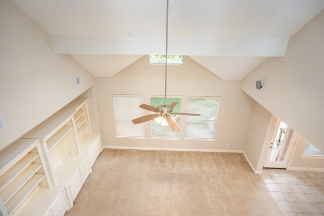 interior space featuring beam ceiling, tile patterned flooring, and ceiling fan