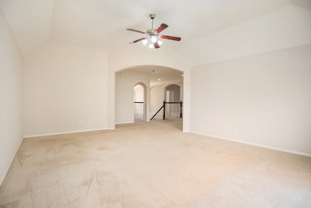 carpeted spare room with lofted ceiling and ceiling fan