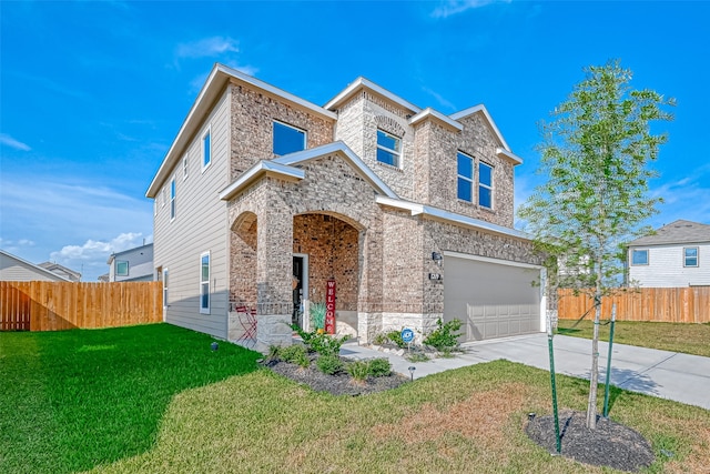 view of front of house with a garage and a front lawn