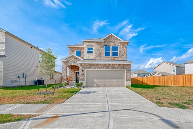 view of front of house featuring a front yard and a garage