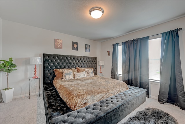 bedroom with carpet and a textured ceiling