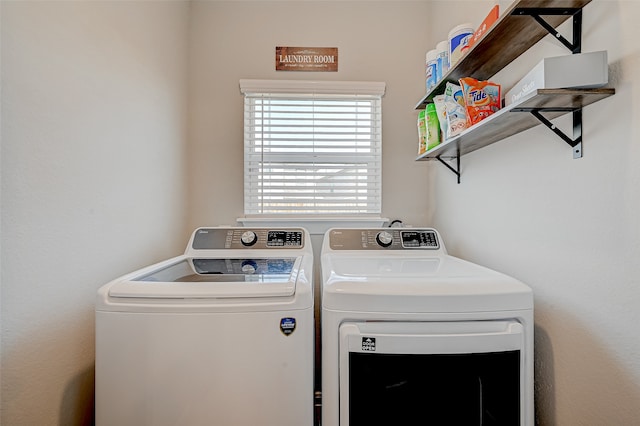 laundry area with washing machine and clothes dryer