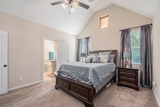 bedroom with ceiling fan, connected bathroom, high vaulted ceiling, and light carpet