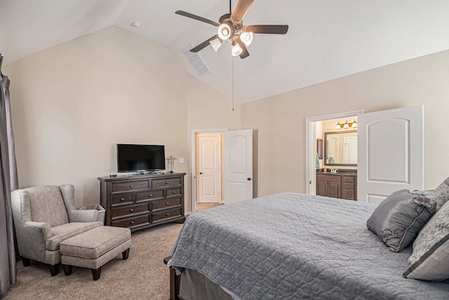 bedroom with high vaulted ceiling, ensuite bath, ceiling fan, and light colored carpet