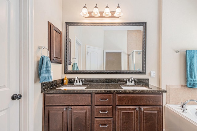 207 Cheswood Forest Pl, Montgomery, TX 77316 - full bathroom featuring a shower stall, double vanity, a sink, and a garden tub