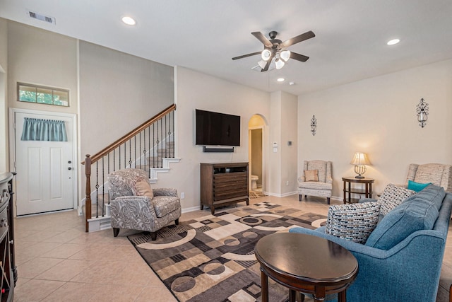 207 Cheswood Forest Pl, Montgomery, TX 77316 - living room with stairway, a ceiling fan, visible vents, arched walkways, and recessed lighting