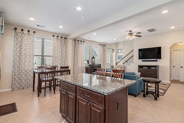 207 Cheswood Forest Pl, Montgomery, TX 77316 - kitchen with visible vents, recessed lighting, a ceiling fan, a center island, and light tile patterned floors