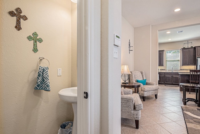 bathroom featuring tile patterned flooring and sink