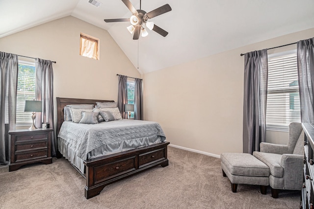 bedroom featuring light carpet, lofted ceiling, and ceiling fan