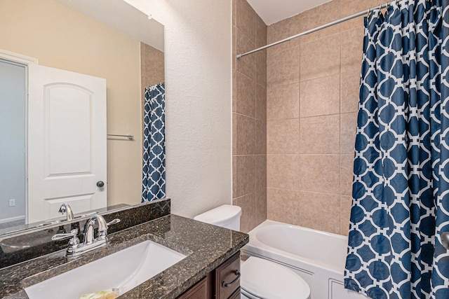 full bathroom featuring vanity, shower / bath combination with curtain, and toilet