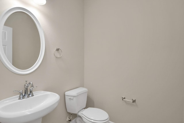 bathroom with toilet and sink