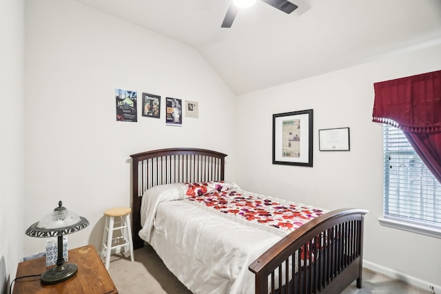 carpeted bedroom with ceiling fan and lofted ceiling