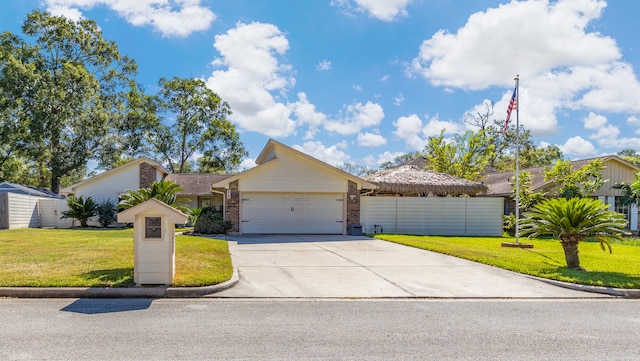 ranch-style home with a front yard and a garage