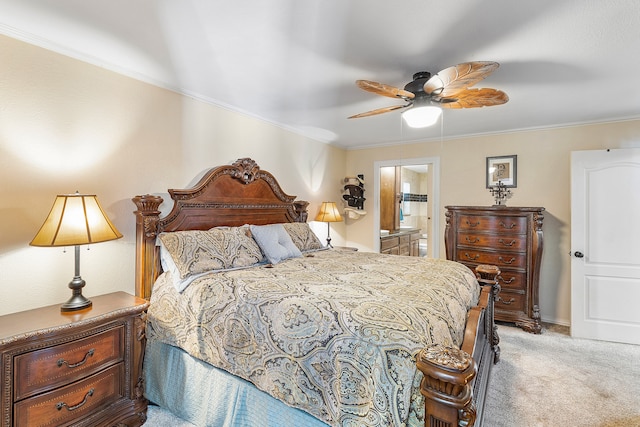 carpeted bedroom featuring ornamental molding, ceiling fan, and ensuite bathroom