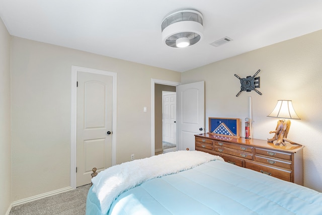 bedroom featuring light carpet