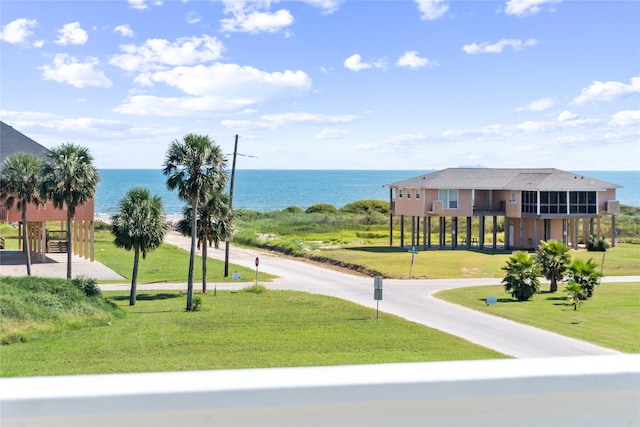 view of property's community featuring a water view and a yard