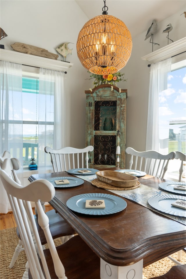 dining area with a chandelier and hardwood / wood-style flooring