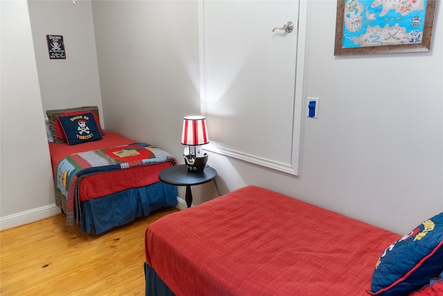 bedroom with wood-type flooring