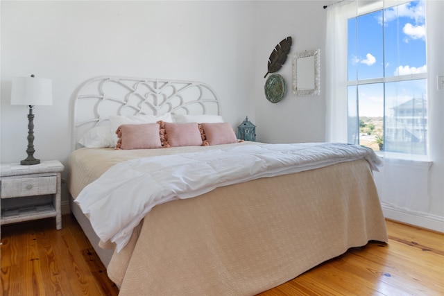 bedroom featuring wood-type flooring