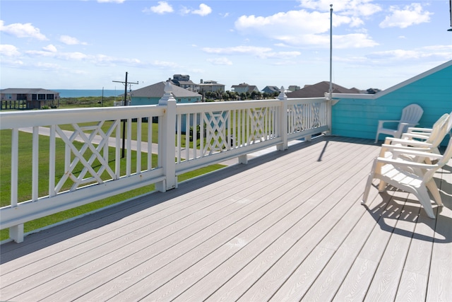 wooden terrace with a lawn