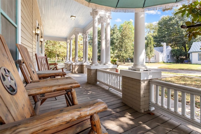 wooden terrace featuring covered porch