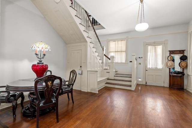 dining space with dark hardwood / wood-style flooring