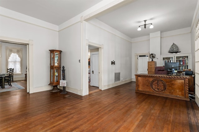 interior space with a notable chandelier and dark hardwood / wood-style floors