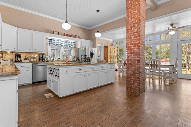 kitchen with pendant lighting, white cabinetry, dishwasher, ornate columns, and dark hardwood / wood-style flooring