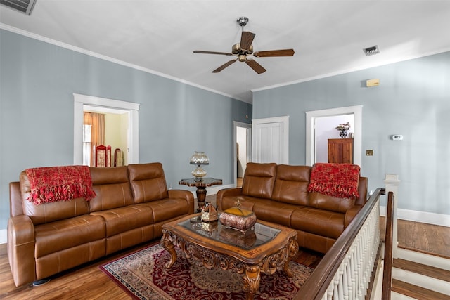 living room featuring ceiling fan, hardwood / wood-style flooring, and ornamental molding